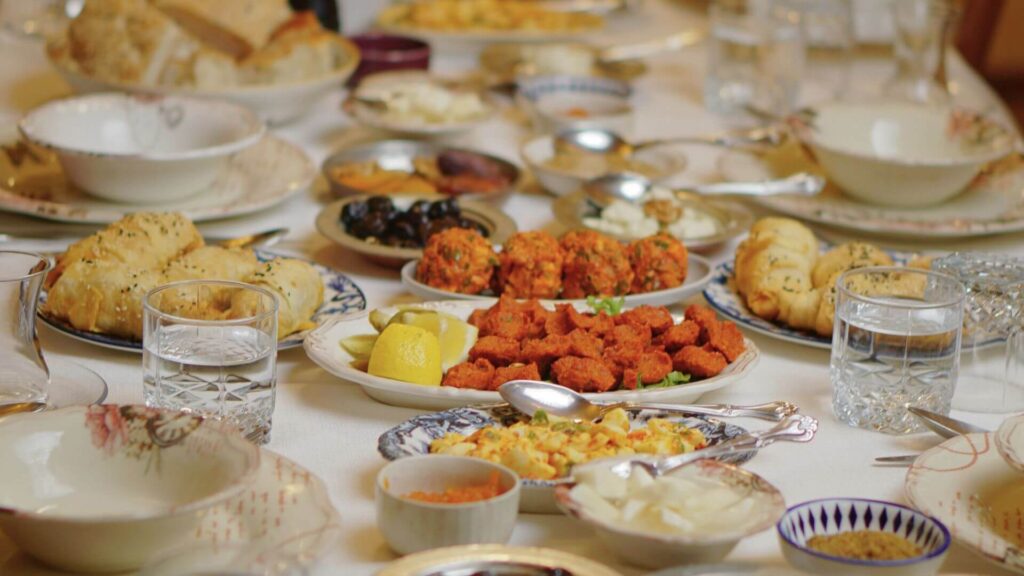 A dining table set for Easter with a spread of seasonal dishes.