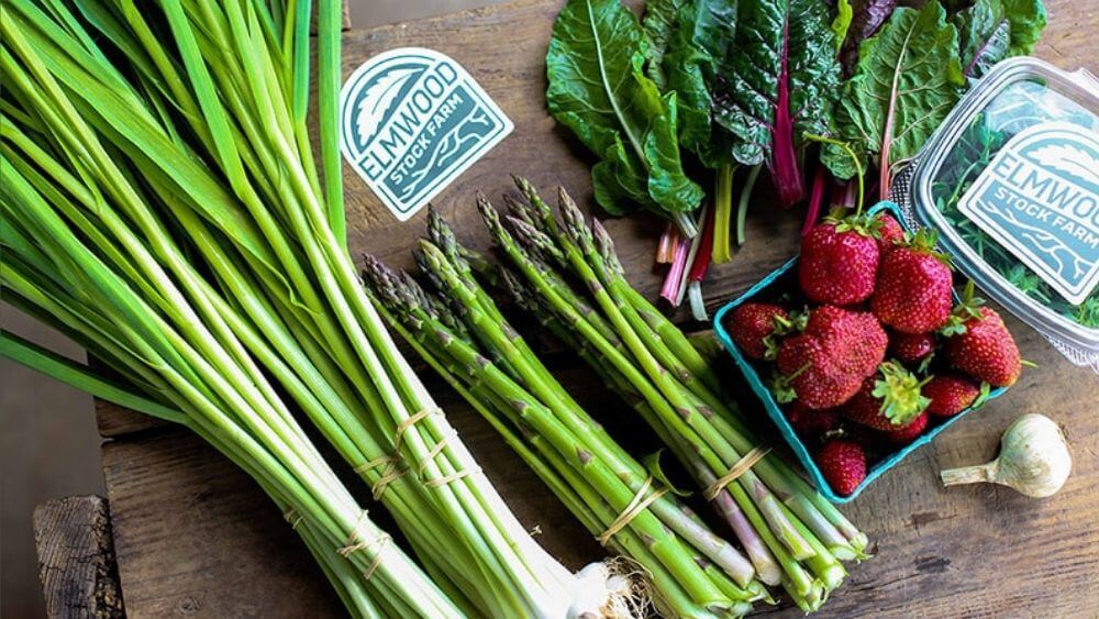 An organic CSA, featuring strawberries, asparagus, green garlic, chard, and microgreens